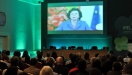 Delegates in St. George’s Hall, Dublin Castle, watching a video address from Mrs. Neelie Kroes, Vice-President of the European Commission