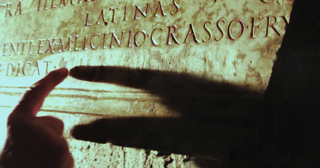 A touch reading of a partially-faded inscription in the catacombs of St. Alexander on via Nomentana in Rome. Picture by Giorgio Crimi. 