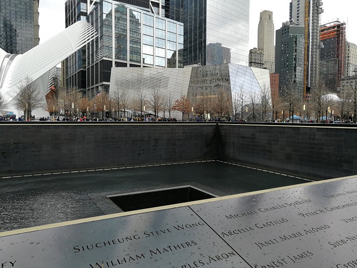 Ground Zero: North Tower; on the background 9/11 Memorial & Museum